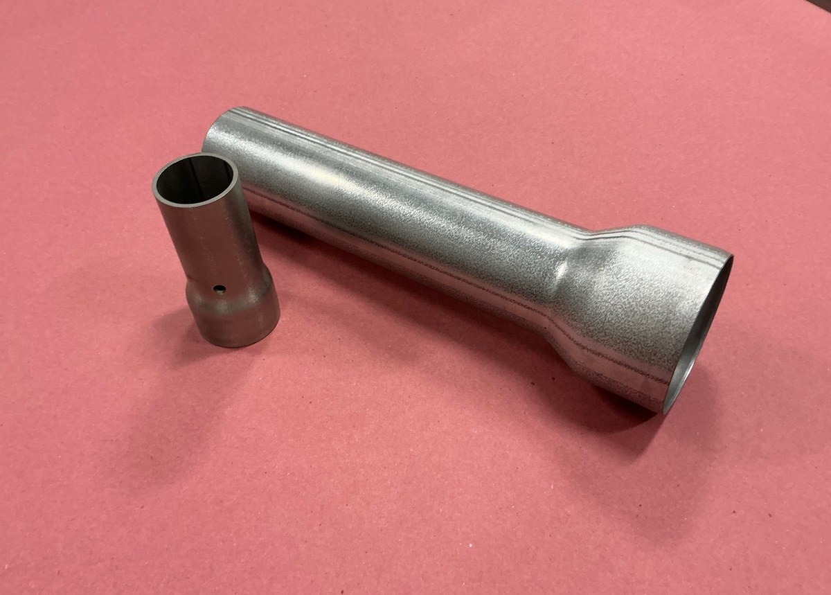 Swaged and expanded tube components